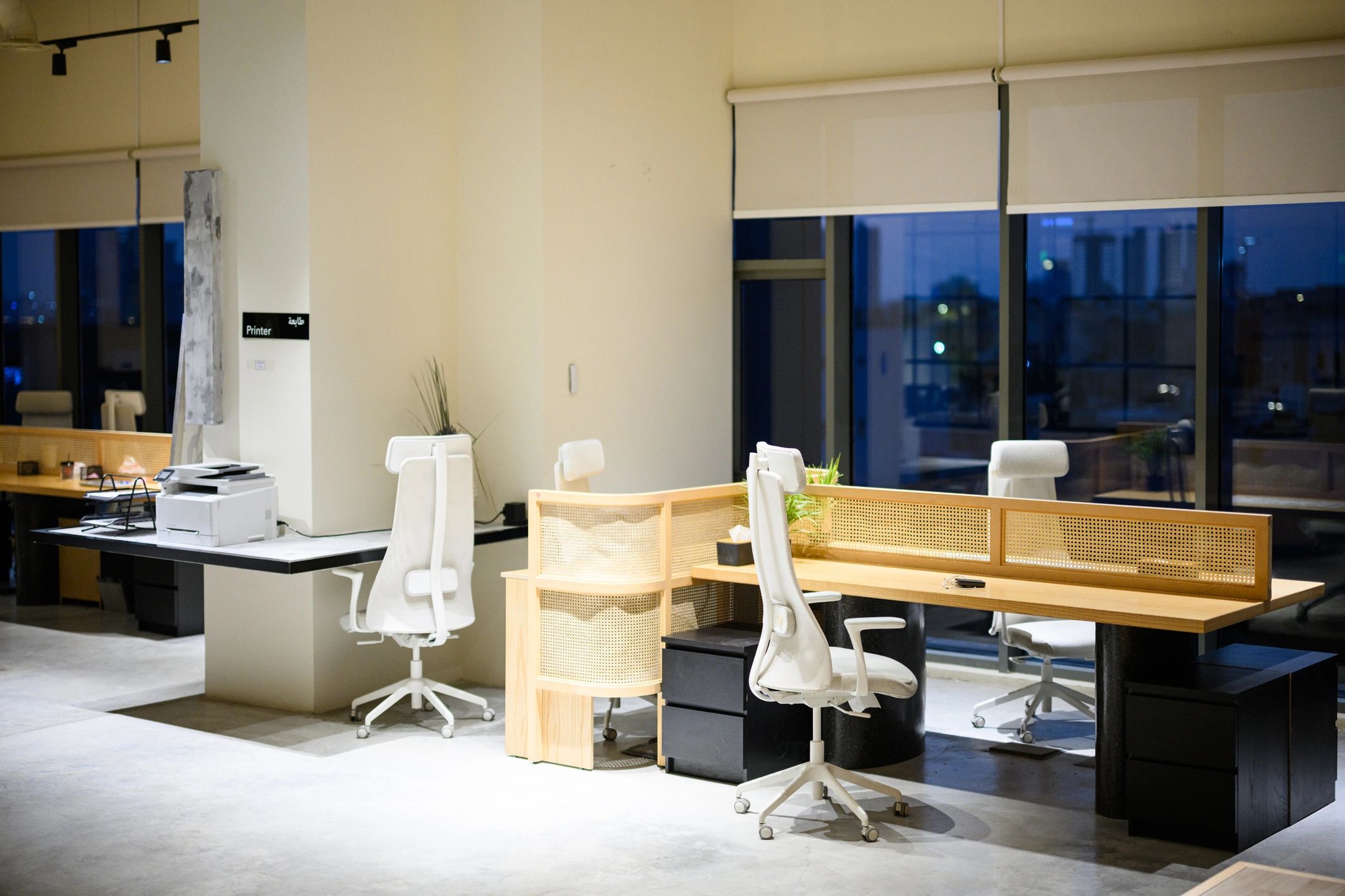 Contemporary organized workspace with shared desks and calm modern interior